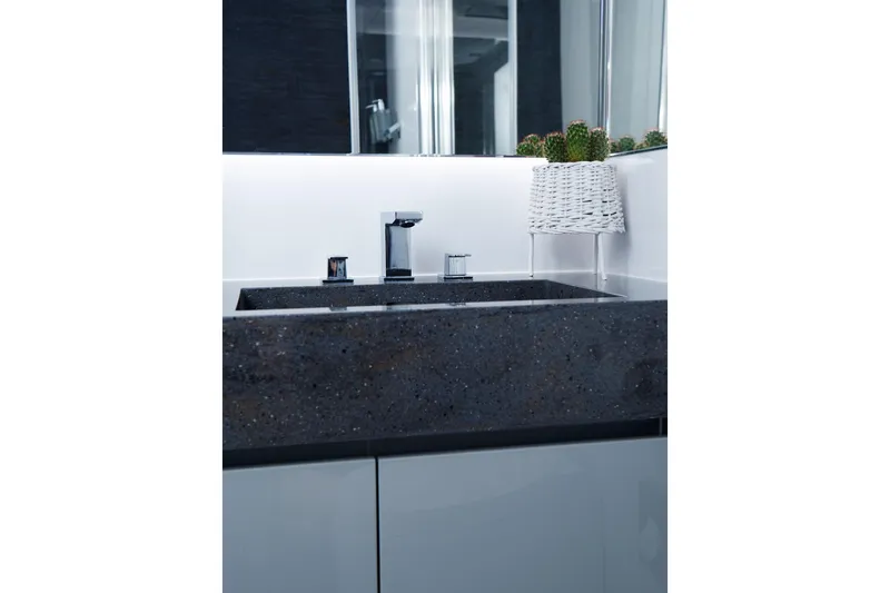  Yacht Photos Pics Modern bathroom sink with sleek faucet and decorative cactus, Sunreef 74 yacht, 2015 model.