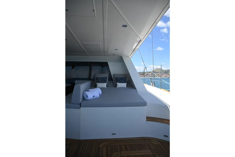  Yacht Photos Pics Luxurious Sunreef 74 yacht deck with comfortable seating, 2015 model, ocean view.