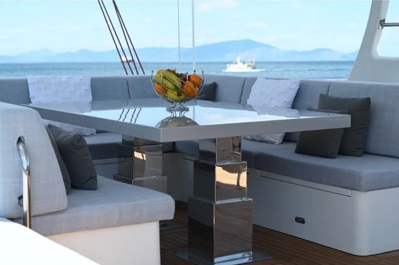  Yacht Photos Pics Luxurious Sunreef 74 yacht deck with elegant seating and fruit centerpiece, 2015 model.