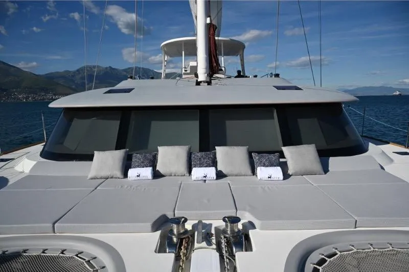  Yacht Photos Pics Luxurious Sunreef 74 yacht deck with cushions, 2015 model, sailing on a clear day.