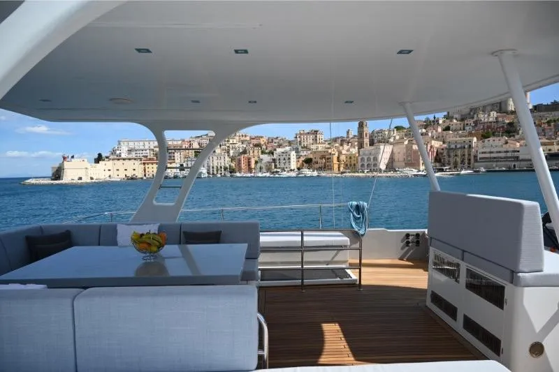  Yacht Photos Pics Luxurious Sunreef 74 yacht deck with cityscape view, 2015 model.