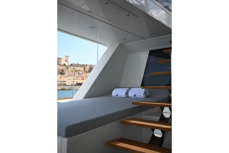  Yacht Photos Pics Luxurious interior of 2015 Sunreef 74 yacht with modern staircase and comfortable seating.