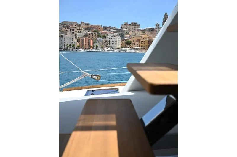  Yacht Photos Pics Sunreef 74 yacht deck with coastal town view, 2015 model.