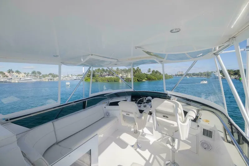 Hanalei Yacht Photos Pics 1999 Hatteras 52 Sport Deck Motor Yacht helm with ocean view and luxurious seating.