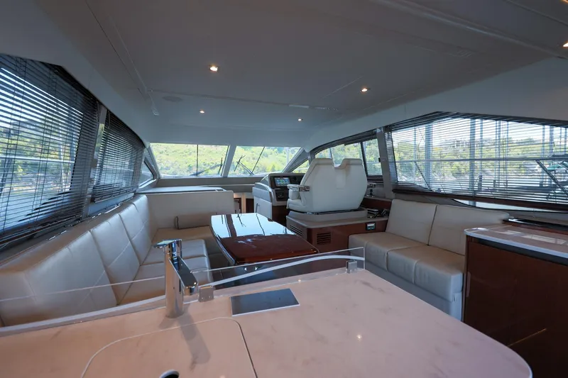 Smooth Yacht Photos Pics Luxurious interior of 2018 Sea Ray Fly 460 yacht with modern seating and helm.