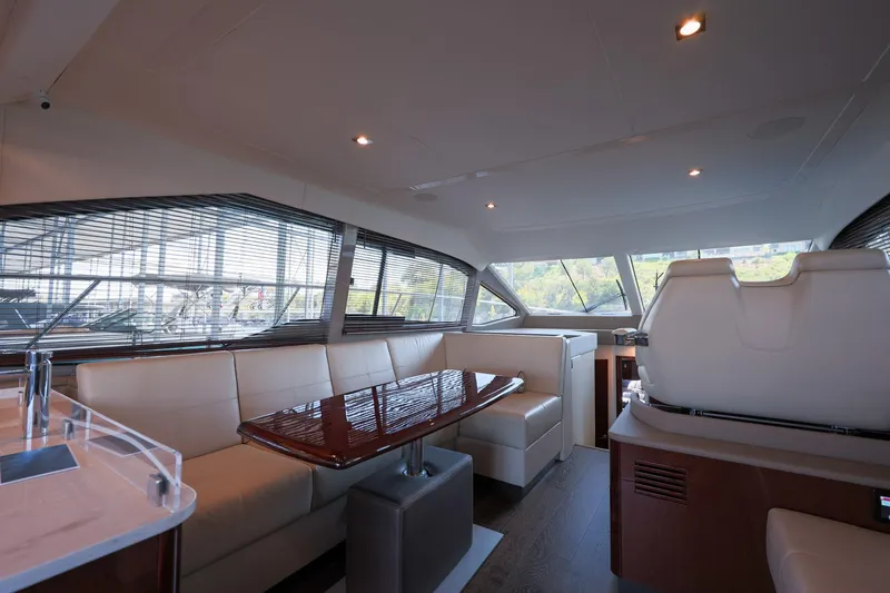 Smooth Yacht Photos Pics Luxurious interior of 2018 Sea Ray Fly 460 yacht with elegant seating and panoramic windows.