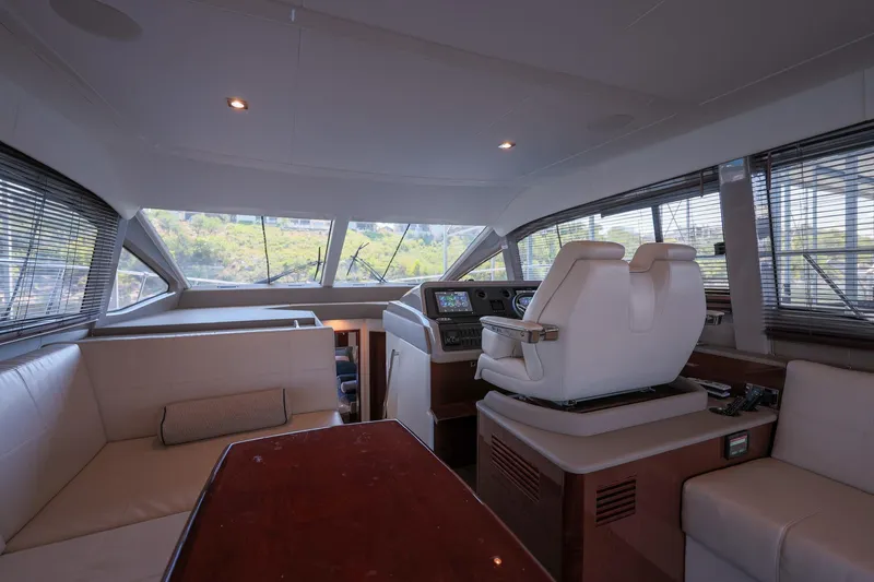 Smooth Yacht Photos Pics Luxurious interior of 2018 Sea Ray Fly 460 yacht with modern helm and seating.