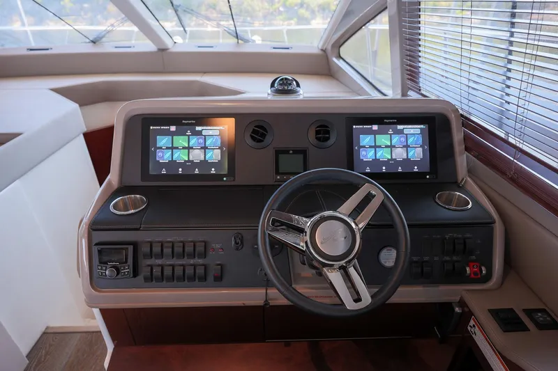 Smooth Yacht Photos Pics 2018 Sea Ray Fly 460 yacht helm with dual touchscreen displays and modern controls.