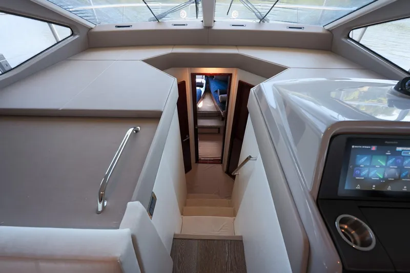 Smooth Yacht Photos Pics Interior view of 2018 Sea Ray Fly 460 yacht, featuring modern design and control panel.