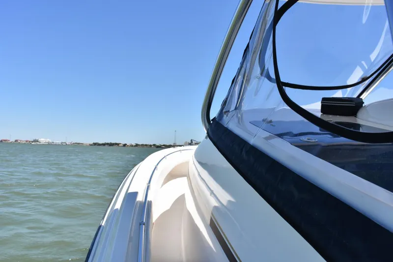 Black Friday Yacht Photos Pics 2008 Contender 36 Fish Around boat on open water.