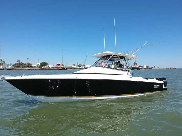Black Friday Yacht Photos Pics 2008 Contender 36 Fish Around boat on the water.