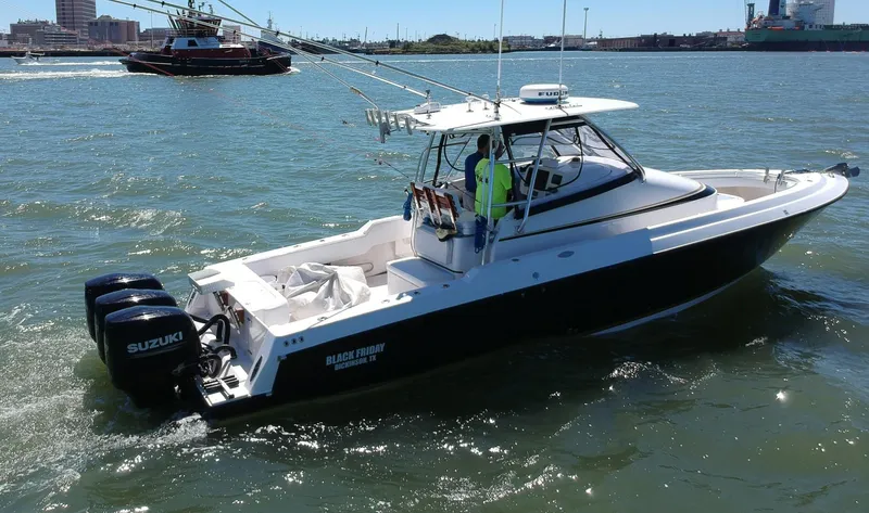 Black Friday Yacht Photos Pics 2008 Contender 36 Fish Around boat with twin Suzuki outboard engines on the water.