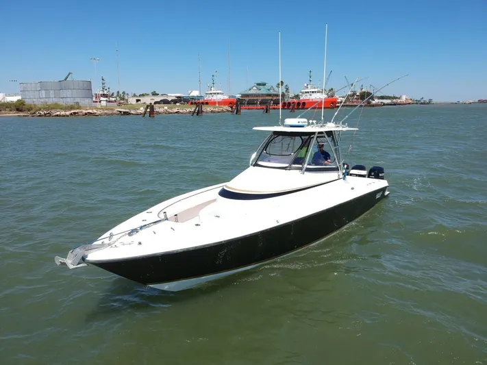 Black Friday Yacht Photos Pics 2008 Contender 36 Fish Around boat on water near docks.
