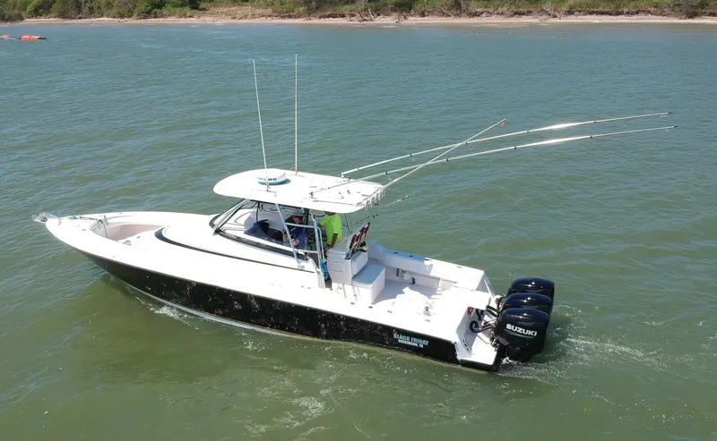 Black Friday Yacht Photos Pics 2008 Contender 36 Fish Around boat cruising on water with dual Suzuki outboard engines.