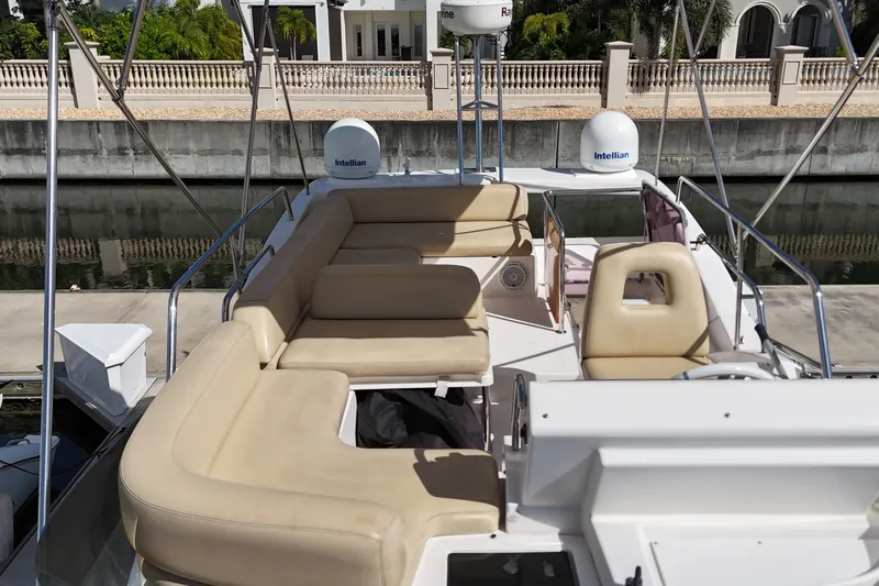  Yacht Photos Pics Flybridge seating area on a 2012 Azimut 40 FLY yacht, docked by a canal.