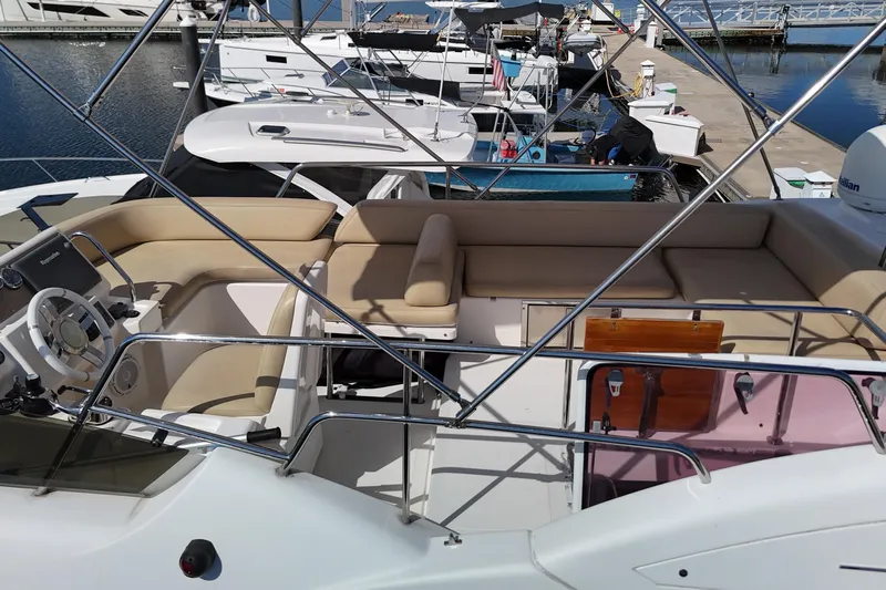  Yacht Photos Pics 2012 Azimut 40 FLY yacht with spacious flybridge and seating at marina.