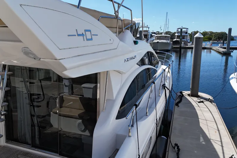  Yacht Photos Pics Azimut 40 FLY 2012 yacht docked at marina, showcasing sleek design and luxury features.