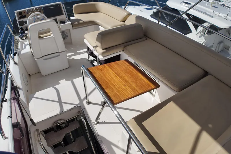  Yacht Photos Pics Flybridge of 2012 Azimut 40 FLY yacht with seating and wooden table.