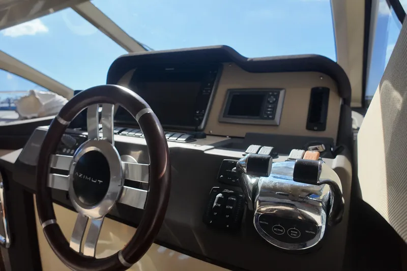  Yacht Photos Pics Steering wheel and controls of 2012 Azimut 40 FLY yacht cockpit.