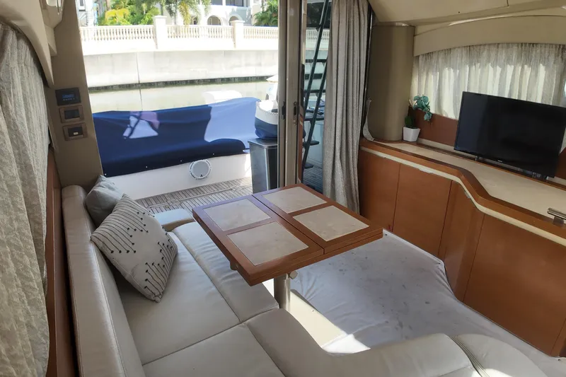  Yacht Photos Pics Luxurious interior of 2012 Azimut 40 FLY yacht with sofa, table, and TV.