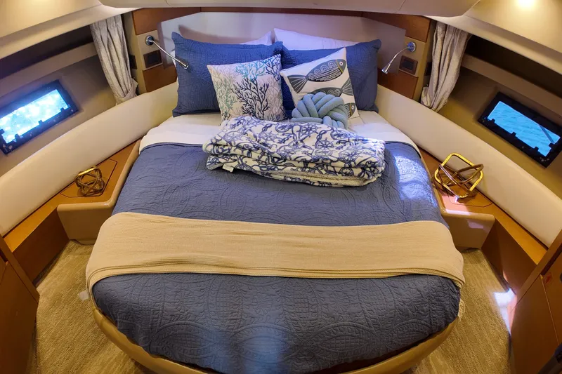  Yacht Photos Pics Luxurious bedroom interior of 2012 Azimut 40 FLY yacht with elegant bedding and decor.