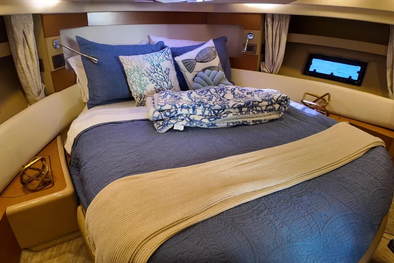  Yacht Photos Pics Luxurious bedroom interior of 2012 Azimut 40 FLY yacht with elegant bedding and decor.