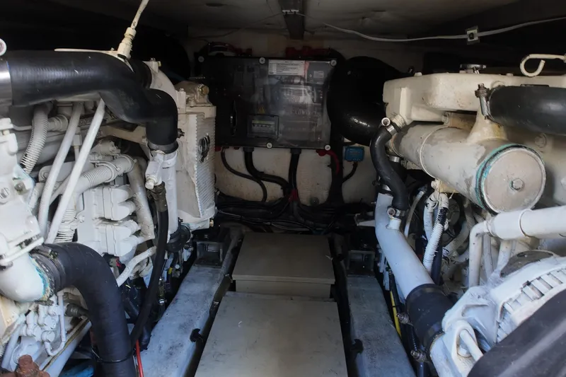  Yacht Photos Pics Engine room of a 2012 Azimut 40 FLY yacht, showcasing dual engines and mechanical components.