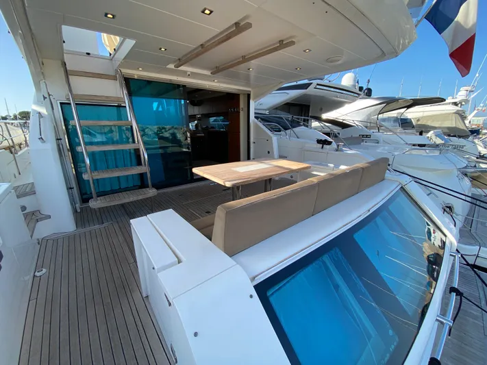 Coco Yacht Photos Pics 2012 Fairline Squadron 65 yacht with spacious deck and seating area.