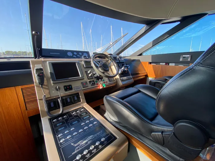 Coco Yacht Photos Pics Helm of 2012 Fairline Squadron 65 yacht with modern controls and leather seating.