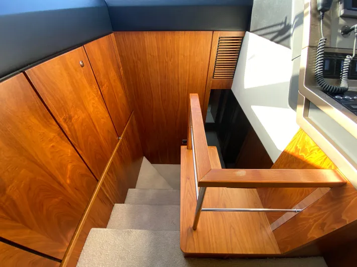 Coco Yacht Photos Pics Staircase with wooden paneling inside a 2012 Fairline Squadron 65 yacht.