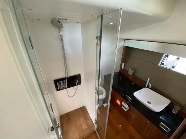 Coco Yacht Photos Pics Luxurious bathroom in 2012 Fairline Squadron 65 yacht with modern shower and sink.