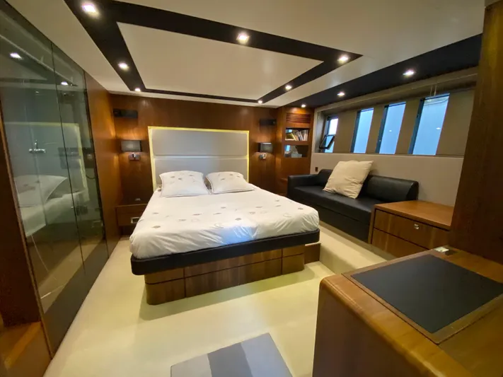 Coco Yacht Photos Pics Luxurious bedroom interior of 2012 Fairline Squadron 65 yacht with modern design and cozy ambiance.