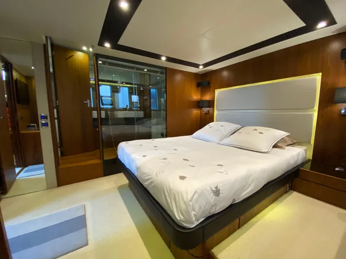 Coco Yacht Photos Pics Luxurious bedroom interior of 2012 Fairline Squadron 65 yacht with modern design and ambient lighting.