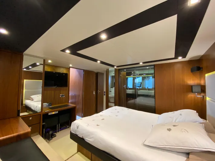 Coco Yacht Photos Pics Luxurious bedroom interior of 2012 Fairline Squadron 65 yacht with modern design and ambient lighting.