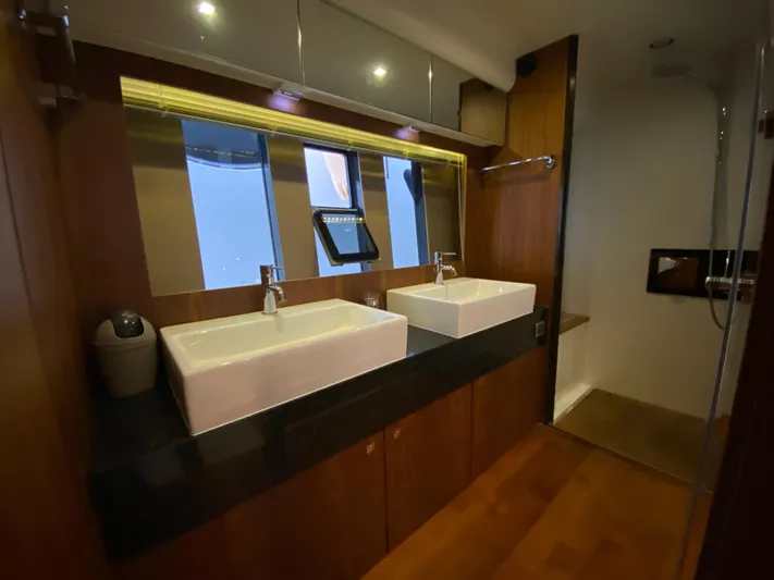 Coco Yacht Photos Pics Luxurious bathroom in 2012 Fairline Squadron 65 yacht with dual sinks and modern fixtures.