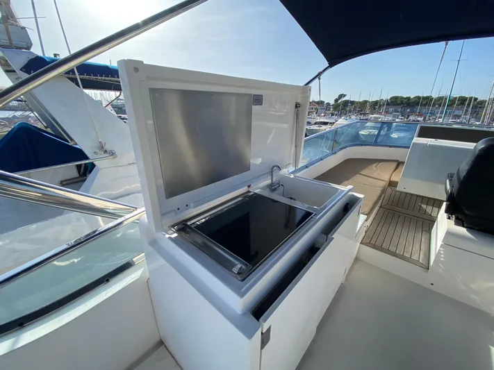 Coco Yacht Photos Pics Outdoor kitchen on 2012 Fairline Squadron 65 yacht, featuring grill and sink.