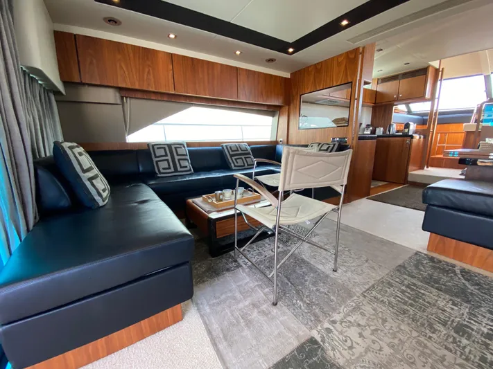 Coco Yacht Photos Pics Luxurious interior of 2012 Fairline Squadron 65 yacht with modern seating and elegant decor.