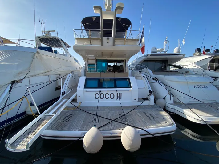 Coco Yacht Photos Pics 2012 Fairline Squadron 65 yacht docked at marina, rear view.