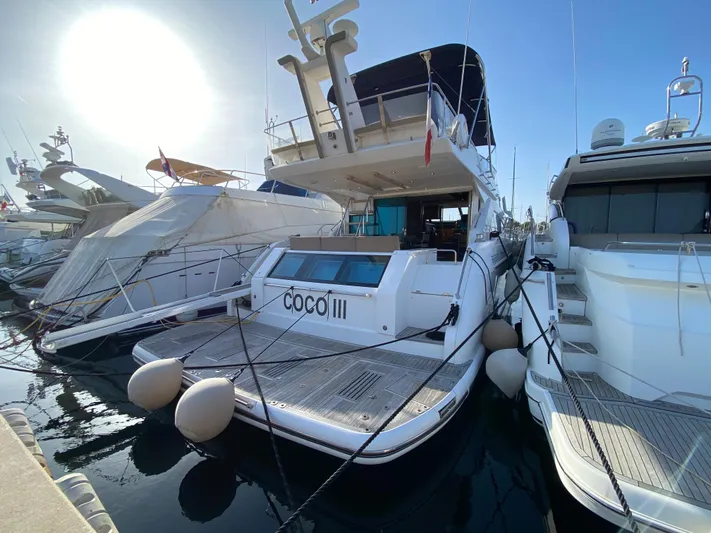 Coco Yacht Photos Pics 2012 Fairline Squadron 65 yacht docked in marina, rear view.