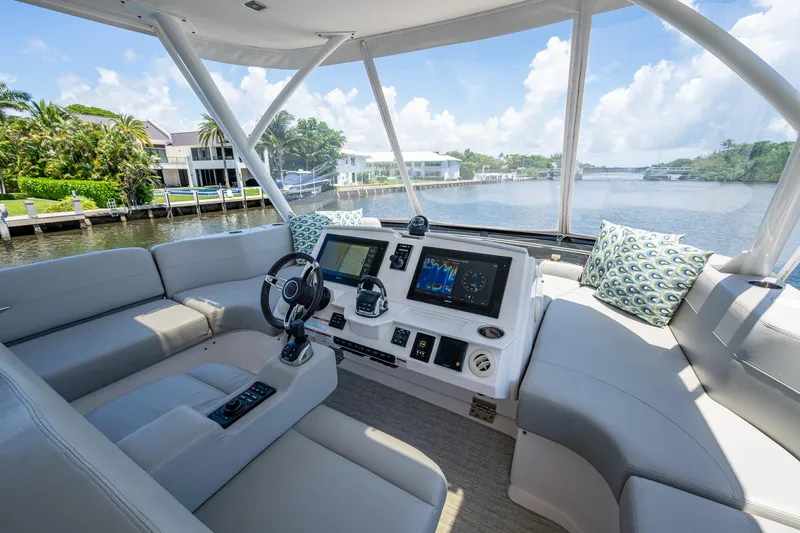 Hwyl Fawr Yacht Photos Pics Luxurious 2018 Tiara Yachts F53 Flybridge interior with modern navigation system and plush seating.