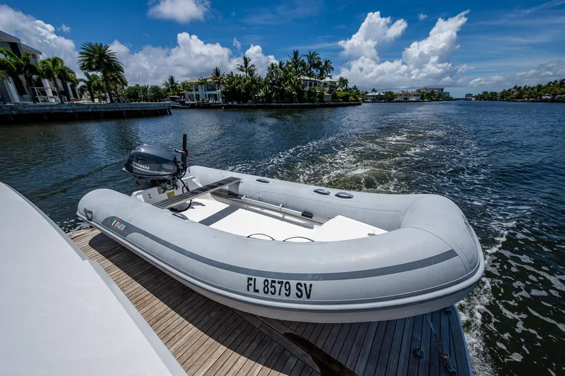 Hwyl Fawr Yacht Photos Pics Inflatable boat on Tiara Yachts F53 Flybridge, 2018, cruising a scenic waterway.
