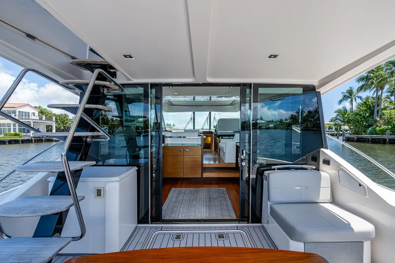 Hwyl Fawr Yacht Photos Pics 2018 Tiara Yachts F53 Flybridge interior with modern design and waterfront view.