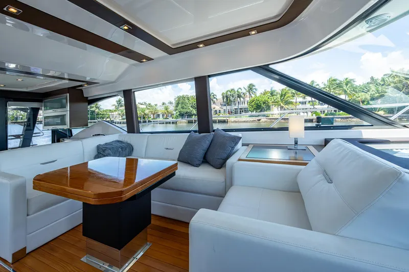 Hwyl Fawr Yacht Photos Pics Luxurious interior of 2018 Tiara Yachts F53 Flybridge with elegant seating and scenic views.