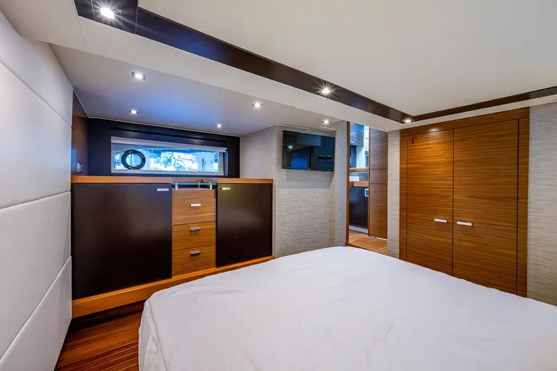 Hwyl Fawr Yacht Photos Pics Luxurious cabin interior of 2018 Tiara Yachts F53 Flybridge with modern wood finishes.