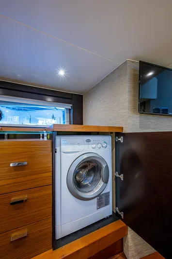 Hwyl Fawr Yacht Photos Pics 2018 Tiara Yachts F53 Flybridge interior with built-in washing machine.