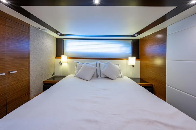 Hwyl Fawr Yacht Photos Pics Luxurious bedroom interior of 2018 Tiara Yachts F53 Flybridge with modern design and cozy bedding.