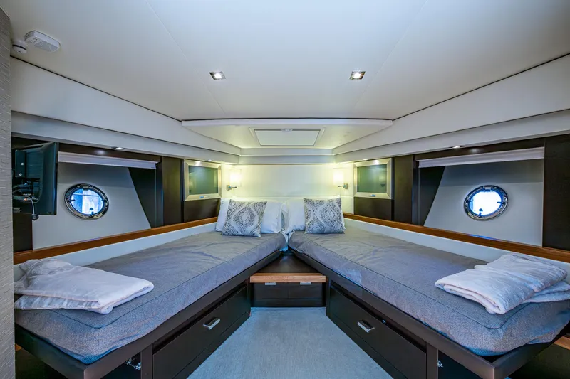 Hwyl Fawr Yacht Photos Pics Luxurious 2018 Tiara Yachts F53 Flybridge cabin with twin beds and modern decor.
