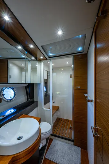 Hwyl Fawr Yacht Photos Pics Luxurious bathroom in 2018 Tiara Yachts F53 Flybridge with modern fixtures and elegant design.