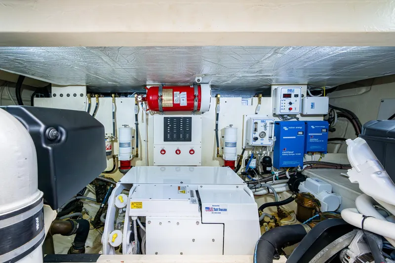 Hwyl Fawr Yacht Photos Pics Engine room of 2018 Tiara Yachts F53 Flybridge, showcasing equipment and systems.