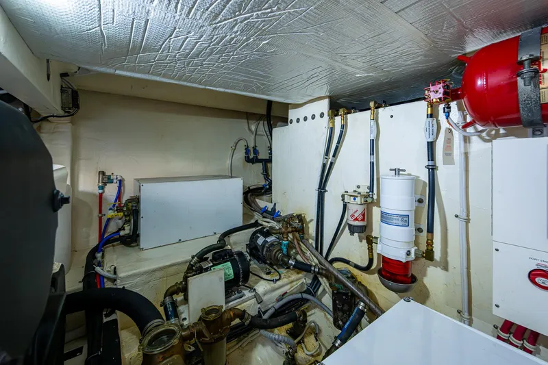 Hwyl Fawr Yacht Photos Pics Engine room of 2018 Tiara Yachts F53 Flybridge, showcasing mechanical components and systems.